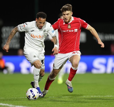 130326 - Wrexham v Swansea City - Sky Bet Championship - Ronald of Swansea and George Thomason of Wrexham