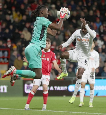 130326 - Wrexham v Swansea City - Sky Bet Championship - Malick Yalcouye of Swansea has his shot on goal saved by Goalkeeper Arthur Okonkwc of Wrexham