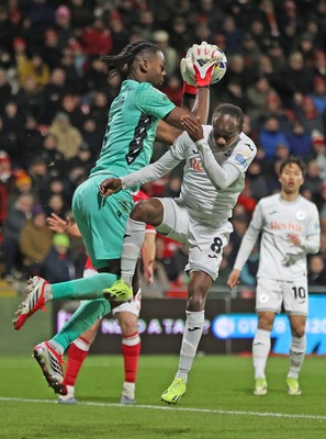 130326 - Wrexham v Swansea City - Sky Bet Championship - Malick Yalcouye of Swansea has his shot on goal saved by Goalkeeper Arthur Okonkwc of Wrexham
