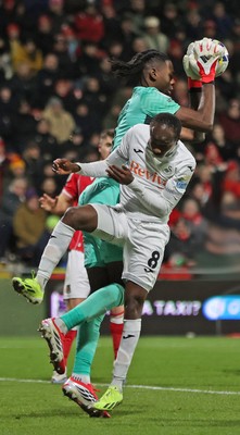 130326 - Wrexham v Swansea City - Sky Bet Championship - Malick Yalcouye of Swansea has his shot on goal saved by Goalkeeper Arthur Okonkwc of Wrexham