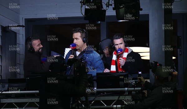 130326 - Wrexham v Swansea City - Sky Bet Championship - Wrexham owners Ryan Reynolds and Rob McElhenney in the gantry preparing to broadcast the match for Sky