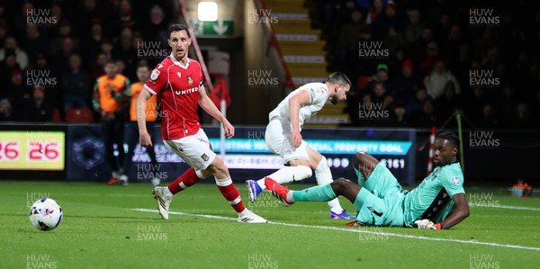 130326 - Wrexham v Swansea City - Sky Bet Championship - Marko Stamenic of Swansea shot saved by a kick from Goalkeeper Arthur Okonkwc of Wrexham