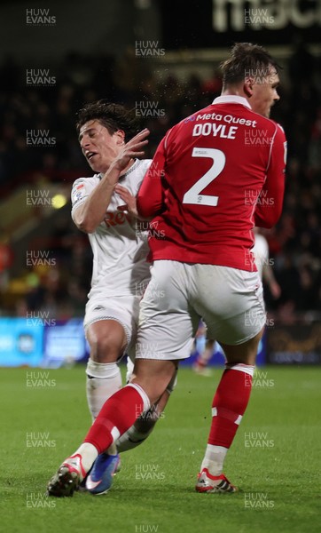 130326 - Wrexham v Swansea City - Sky Bet Championship - Goncalo Franco of Swansea collides with Callum Doyle of Wrexham