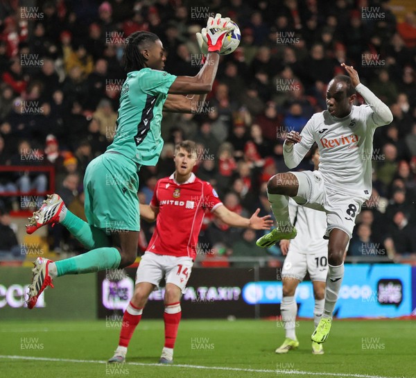 130326 - Wrexham v Swansea City - Sky Bet Championship - Malick Yalcouye of Swansea has his shot on goal saved by Goalkeeper Arthur Okonkwc of Wrexham