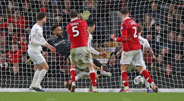 130326 - Wrexham v Swansea City - Sky Bet Championship - Callum Doyle of Wrexham puts the ball past Goalkeeper Lawrence Vigouroux of Swansea for the 2nd Wrexham goal