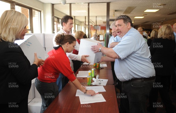 27.09.09 - Welsh Rugby Union Annual General Meeting - Club delegates accept their free SWALEC energy saving light bulbs for their clubs after the WRU AGM. 