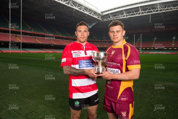 240419 - WRU Finals Day Photocall - Keir Ennis, captain of Oakdale,  left, and Abergavenny captain Ieuan James whose teams will compete in the Bowl Final, during photocall with the trophy ahead of the match