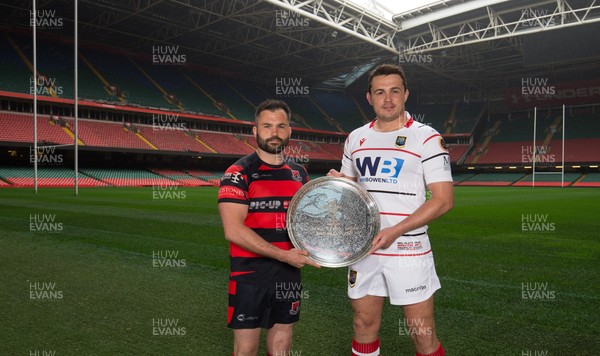 240419 - WRU Finals Day Photocall - Andrew Pritchard, captain of Bonymaen,  left, and Brecon captain Ewan Williams whose teams will compete in the Plate Final, during photocall with the trophy ahead of the match