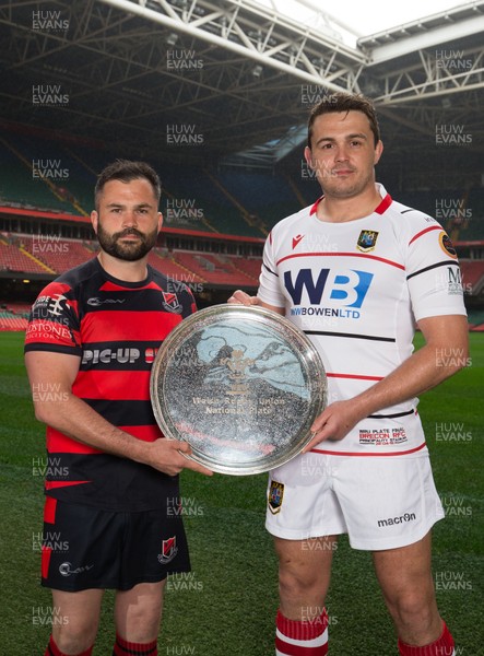 240419 - WRU Finals Day Photocall - Andrew Pritchard, captain of Bonymaen,  left, and Brecon captain Ewan Williams whose teams will compete in the Plate Final, during photocall with the trophy ahead of the match