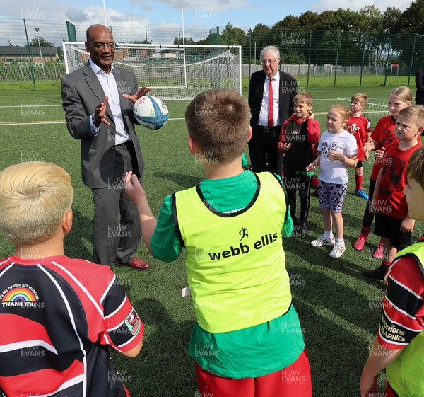 300823 - WRU Fit, Fed and Fun camp at Cardiff West High School - Welsh First Minister Mark Drakeford and  WRU interim CEO Nigel Walker join children to take part in a rugby skills and activities session at the Fit,Fed and Fun camp