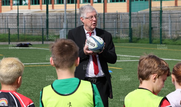 300823 - WRU Fit, Fed and Fun camp at Cardiff West High School - Welsh First Minister Mark Drakeford joins children to take part in a rugby skills and activities session at the Fit,Fed and Fun camp