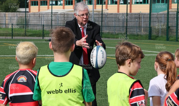 300823 - WRU Fit, Fed and Fun camp at Cardiff West High School - Welsh First Minister Mark Drakeford joins children to take part in a rugby skills and activities session at the Fit,Fed and Fun camp