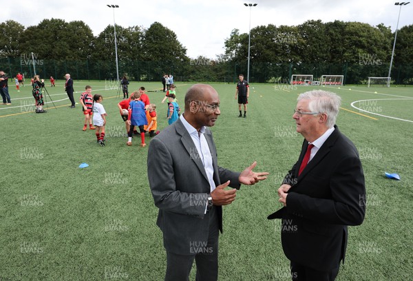 300823 - WRU Fit, Fed and Fun camp at Cardiff West High School - WRU interim CEO Nigel Walker with Welsh First Minister Mark Drakeford as children take part in a rugby skills and activities session at the Fit,Fed and Fun camp