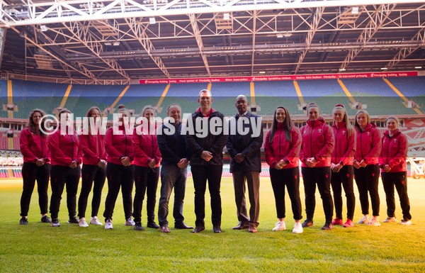 120122 - Welsh Rugby Union Women's Rugby Contracts - Wales Women's coach Ioan Cunningham, centre, with WRU Group Chief Executive Steve Phillips and WRU Performance Director Nigel Walker and players, left to right,  Natalia John, Donna Rose, Lisa Neumann, Carys Phillips, Elinor Snowsill, Ffion Lewis, Siwan Lillicrap, Hannah Jones, Alisha Butchers and Kiera Bevan at the Principality Stadium as the Welsh Rugby Union announce the first 12 Women's full time contracts for international players