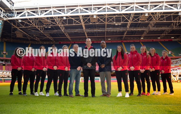 120122 - Welsh Rugby Union Women's Rugby Contracts - Wales Women's coach Ioan Cunningham, centre, with WRU Group Chief Executive Steve Phillips and WRU Performance Director Nigel Walker and players, left to right,  Natalia John, Donna Rose, Lisa Neumann, Carys Phillips, Elinor Snowsill, Ffion Lewis, Siwan Lillicrap, Hannah Jones, Alisha Butchers and Kiera Bevan at the Principality Stadium as the Welsh Rugby Union announce the first 12 Women's full time contracts for international players