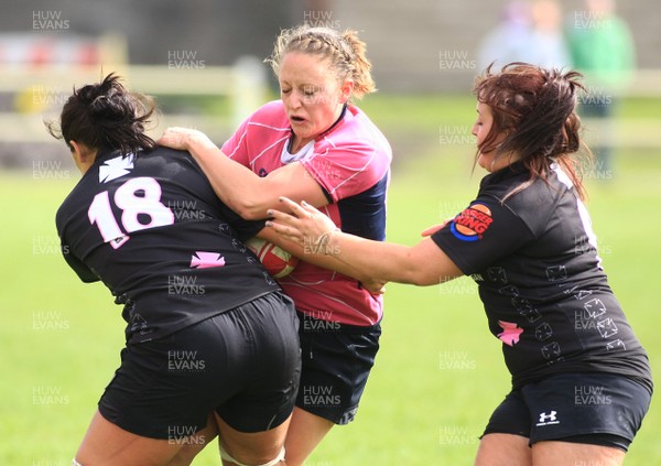 22.05.11 Neath Athletic v Pontyclun Falcons - WRU Women's Finals Day - Pontyclun's Anna Jenkins is tackled byNeath Athletic's  Shona Powell-Hughes(18) & Natalie Watkins. 