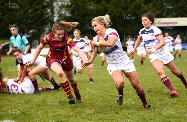 200517 - WRU Women's Super Cup Finals Day - Caernafon v Swansea - Cup Final -  Rosie Fletcher of Swansea beats Iona Evans of Caernarfon to score a try 