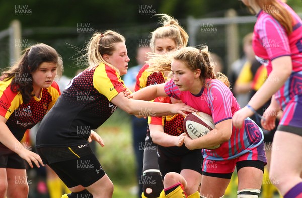 200517 - WRU Women's Super Cup Finals Day - Wattstown v Cardiff Quins - Youth Cup Final -  Charlie Rowley of Cardiff Quins takes on Karmann James of Wattstown 