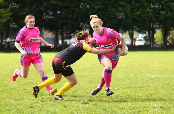 200517 - WRU Women's Super Cup Finals Day - Wattstown v Cardiff Quins - Youth Cup Final -  India Berbillion of Cardiff Quins is tackled by Maiey Evans of Wattstown 