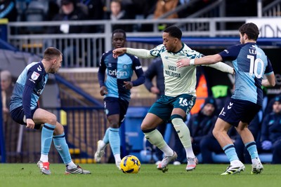 010126 - Wycombe Wanderers v Cardiff City - Sky Bet League 1 - Chris Willock of Cardiff City is challenged by Luke Leahy of Wycombe Wanderers