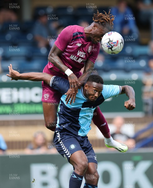290723 - Wycombe Wanderers v Cardiff City, Pre-season Friendly - Ike Ugbo of Cardiff City gets above Brandon Hanlan of Wycombe Wanderers to head the ball