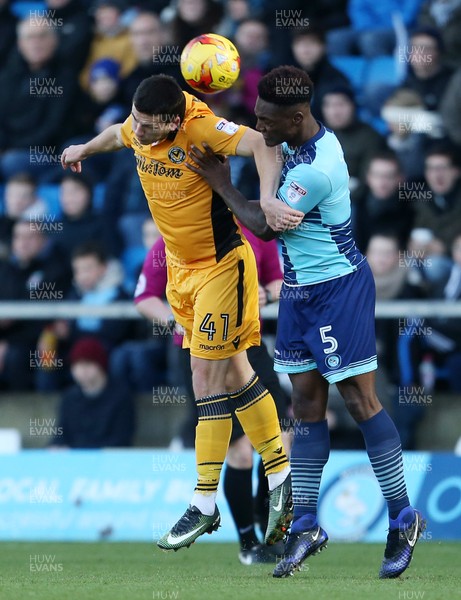 020117 - Wycombe Wanders v Newport County - SkyBet League Two - Aaron Williams of Newport County and Anthony Stewart of Wycombe Wanderers go up for the ball by Chris Fairweather/Huw Evans Agency