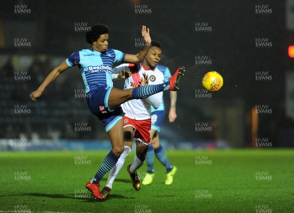 261217 - Wycombe Wanderers v Newport County - Sky Bet League 2 -  
Sido Jombati of Wycombe clears from Newports Shawn McCoulsky