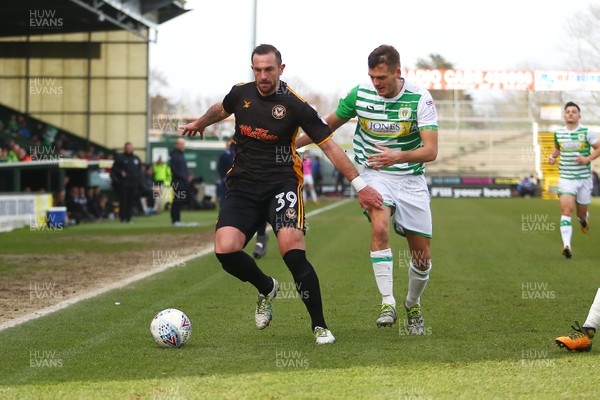 100318 - Yeovil Town v Newport County - EFL SkyBet League 2 - Paul Hayes of Newport County takes on Thomas James of Yeovil Town 