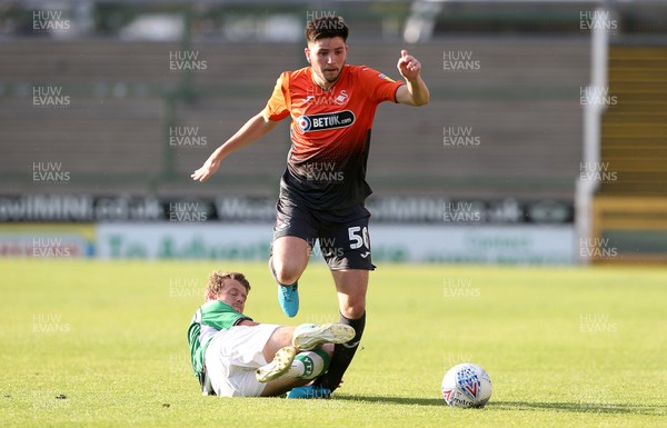 100718 - Yeovil Town v Swansea City - Pre Season Friendly - Cian Harries of Swansea City is tackled by Alex Fisher of Yeovil
