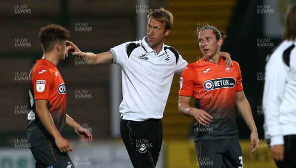 100718 - Yeovil Town v Swansea City - Pre Season Friendly - Swansea City Manager Graham Potter with his arm around Aaron Lewis of Swansea City