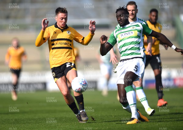 300319 - Yeovil v Newport County - SkyBet League 2 - Harry McKirdy of Newport County is tackled by Bevis Mugabi of Yeovil