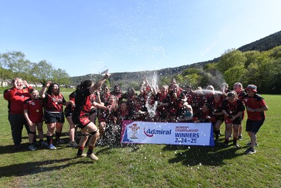 270425 - Ynysddu BG Ladies v Haverfordwest - Admiral Women's National League Championship - Ynysddu BG Ladies Captain, Emily Parker celebrates with her team as they lift the trophy