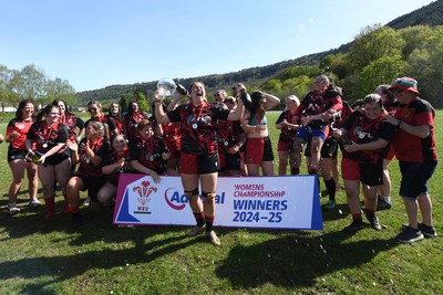 270425 - Ynysddu BG Ladies v Haverfordwest - Admiral Women's National League Championship - Ynysddu BG Ladies Captain, Emily Parker celebrates with her team as they lift the trophy
