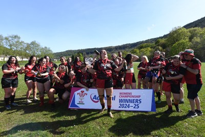 270425 - Ynysddu BG Ladies v Haverfordwest - Admiral Women's National League Championship - Ynysddu BG Ladies Captain, Emily Parker celebrates with her team as they lift the trophy