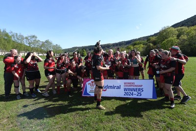 270425 - Ynysddu BG Ladies v Haverfordwest - Admiral Women's National League Championship - Ynysddu BG Ladies Captain, Emily Parker celebrates with her team as they lift the trophy