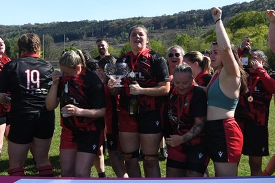 270425 - Ynysddu BG Ladies v Haverfordwest - Admiral Women's National League Championship - Ynysddu BG Ladies Captain, Emily Parker celebrates with her team as they lift the trophy
