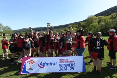 270425 - Ynysddu BG Ladies v Haverfordwest - Admiral Women's National League Championship - Ynysddu BG Ladies Captain, Emily Parker celebrates with her team as they lift the trophy