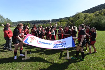270425 - Ynysddu BG Ladies v Haverfordwest - Admiral Women's National League Championship - Ynysddu BG Ladies Captain, Emily Parker celebrates with her team as they lift the trophy