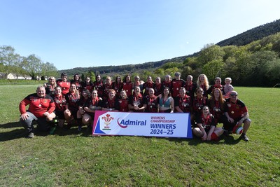 270425 - Ynysddu BG Ladies v Haverfordwest - Admiral Women's National League Championship - Ynysddu BG Ladies Captain, Emily Parker celebrates with her team as they lift the trophy
