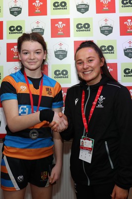 190324 - Ysgol Bryn Celynnog v Ysgol Godre’r Berwyn - WRU Welsh Schools Girls U12 Cup Final - Player of the Match Bryn Celynnog’s Emie George receives her medal from Kira Philpott