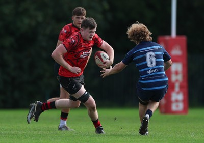 011025 - Ysgol Gyfun Gymraeg Glantaf v Coleg Gwent, WRU Welsh Schools & Colleges league - Josh Bradley of Coleg Gwent takes on Oli Roberts of Ysgol Glantaf