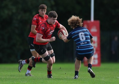 011025 - Ysgol Gyfun Gymraeg Glantaf v Coleg Gwent, WRU Welsh Schools & Colleges league - Josh Bradley of Coleg Gwent takes on Oli Roberts of Ysgol Glantaf