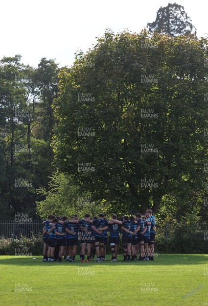 011025 - Ysgol Gyfun Gymraeg Glantaf v Coleg Gwent, WRU Welsh Schools & Colleges league - Ysgol Glantaf huddle up at the end of the match