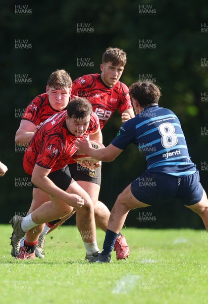 011025 - Ysgol Gyfun Gymraeg Glantaf v Coleg Gwent, WRU Welsh Schools & Colleges league - Morgan Suller of Coleg Gwent takes on Efan Jenkins of Ysgol Glantaf