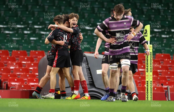 101224 - Ysgol Gyfun Bro Myrddin v Ysgol Gyfun Cwm Rhymni - WSC U18s Champion of Champions - Gwion Evans of Ysgol Gyfun Bro Myrddin celebrates scoring a try with team mates