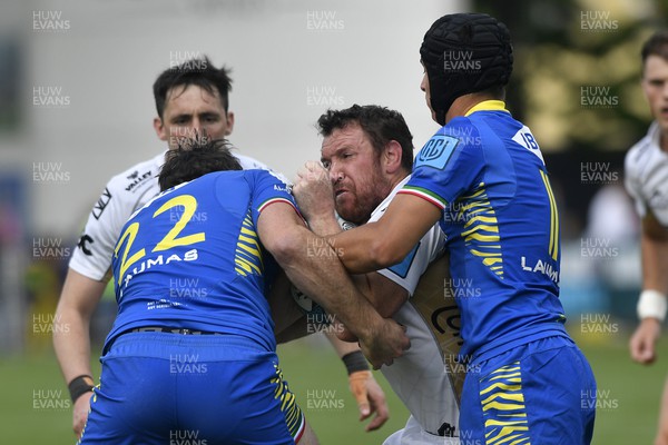 300422 - Zebre Parma v Dragons - United Rugby Championship - Adam Warren of Dragons is tackled by Tim O'Malley (left)
