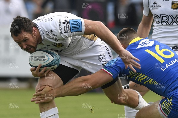 300422 - Zebre Parma v Dragons - United Rugby Championship - Adam Warren of Dragons is tackled by Giampietro Ribaldi