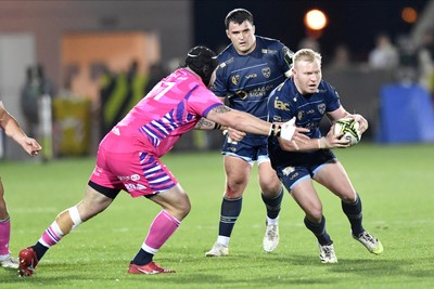 110426 - Zebre Parma v Dragons RFC - EPCR Challenge Cup Quarter Final - Tinus de Beer of Dragons is tackled by Luca Franceschetto of Zebre 