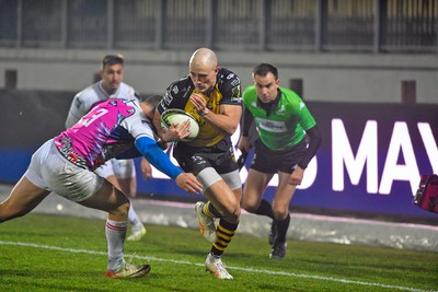 130124 - Zebre Parma v Dragons RFC - EPCR Challenge Cup - Jared Rosser of Dragons is tackled by Luca Morisi 