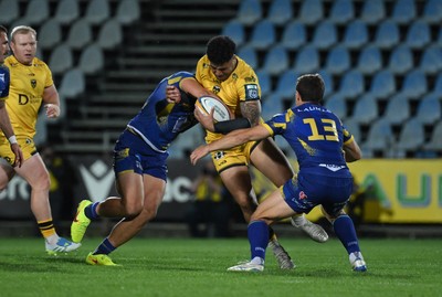 240426 - Zebre Parma v Dragons RFC - United Rugby Championship - Fetuli Paea of Dragons is tackled by Giulio Bertaccini of Zebre (R)